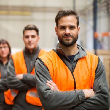 online warehousing safety systems warehouse instilling confidence in workers standing in orange hi-vis jackets