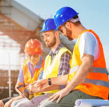 Residential builders using SiteConnect on a tablet to manage site safety digitally.