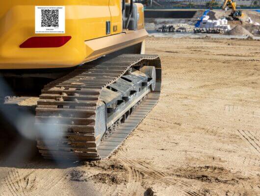 Excavator with a SiteConnect asset QR sticker