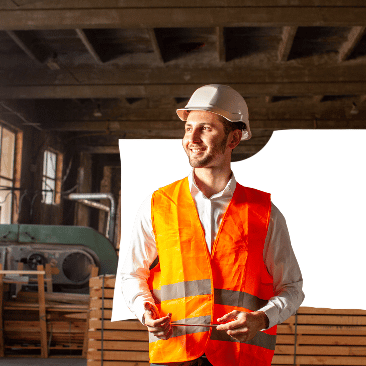 Construction site supervisor in a hard hat and hi-vis vest, managing team responsibilities and health and safety software access control.